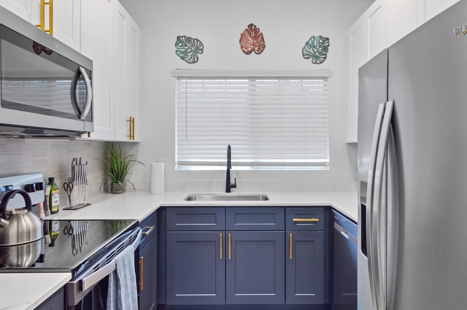 Clean, modern kitchen with sleek appliances for easy cooking.