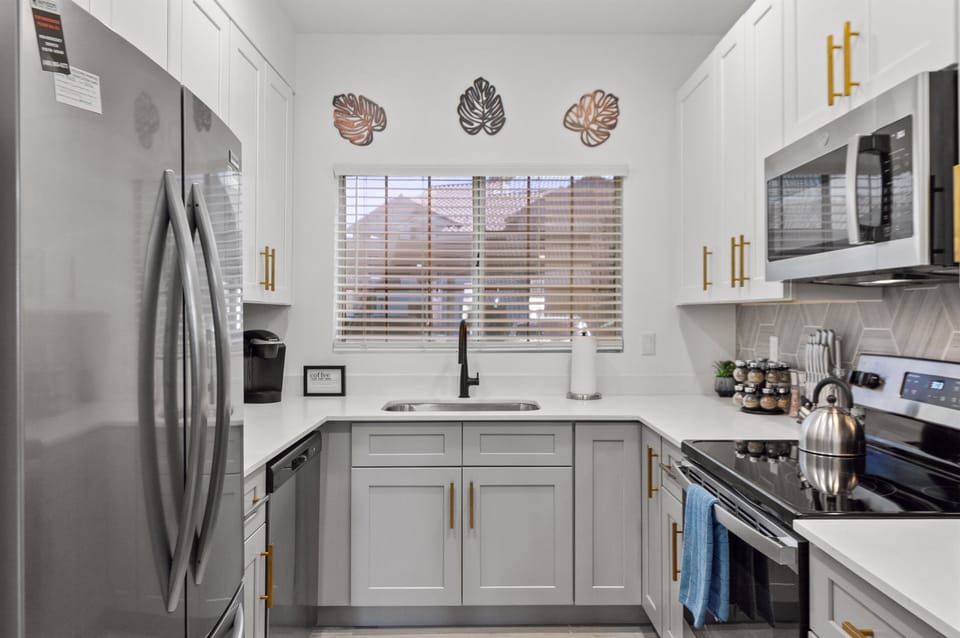 Vibrant blues and sleek kitchen design.