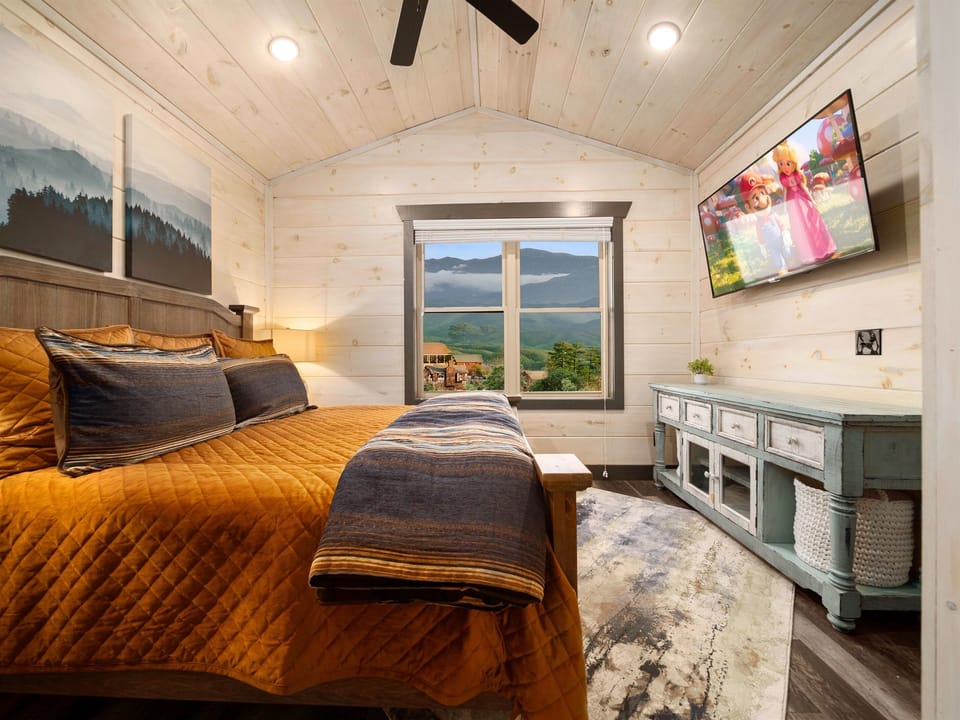 Elegant king bedroom with panoramic mountain views.
