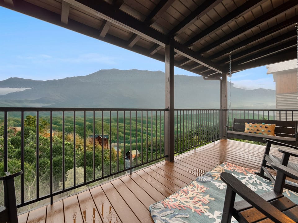 Spacious patio with mountain views for relaxing and dining.