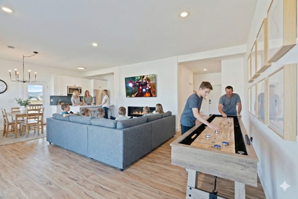 Spacious family hub with shuffleboard, fireplace, and open kitchen