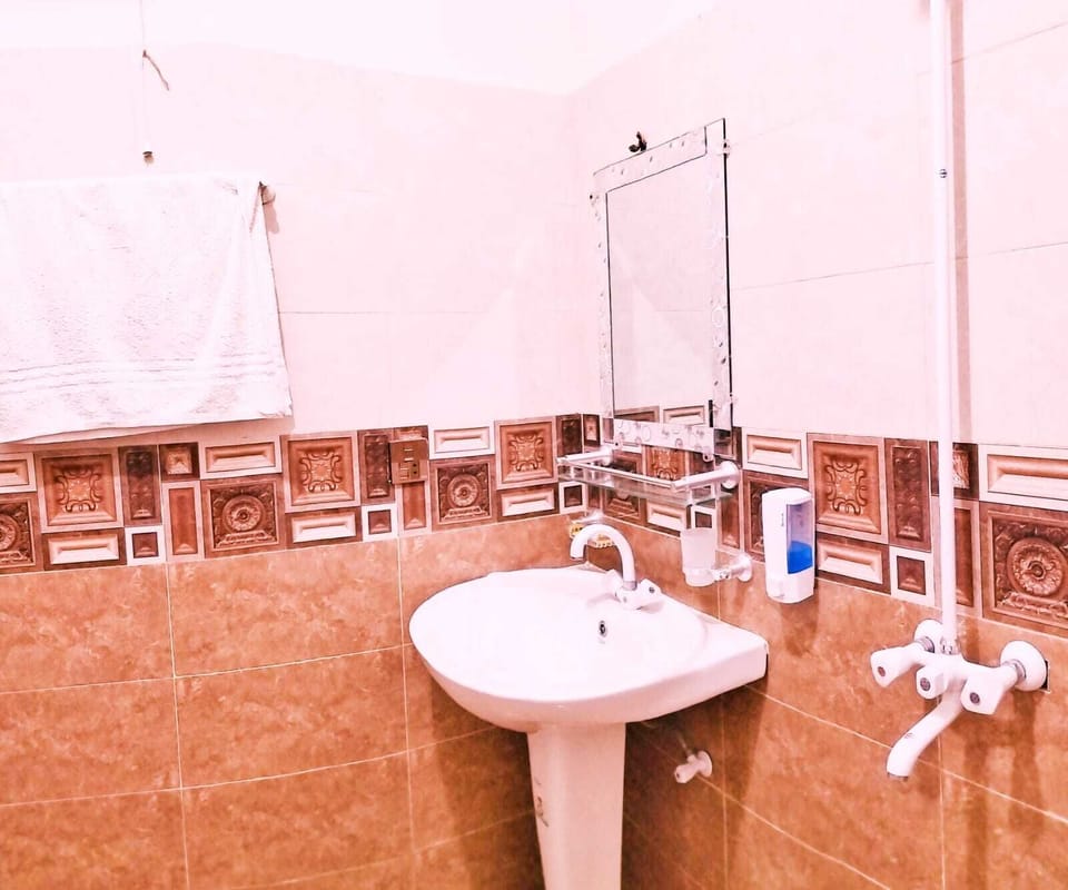 Separate tub and shower, eco-friendly toiletries, hair dryer, slippers