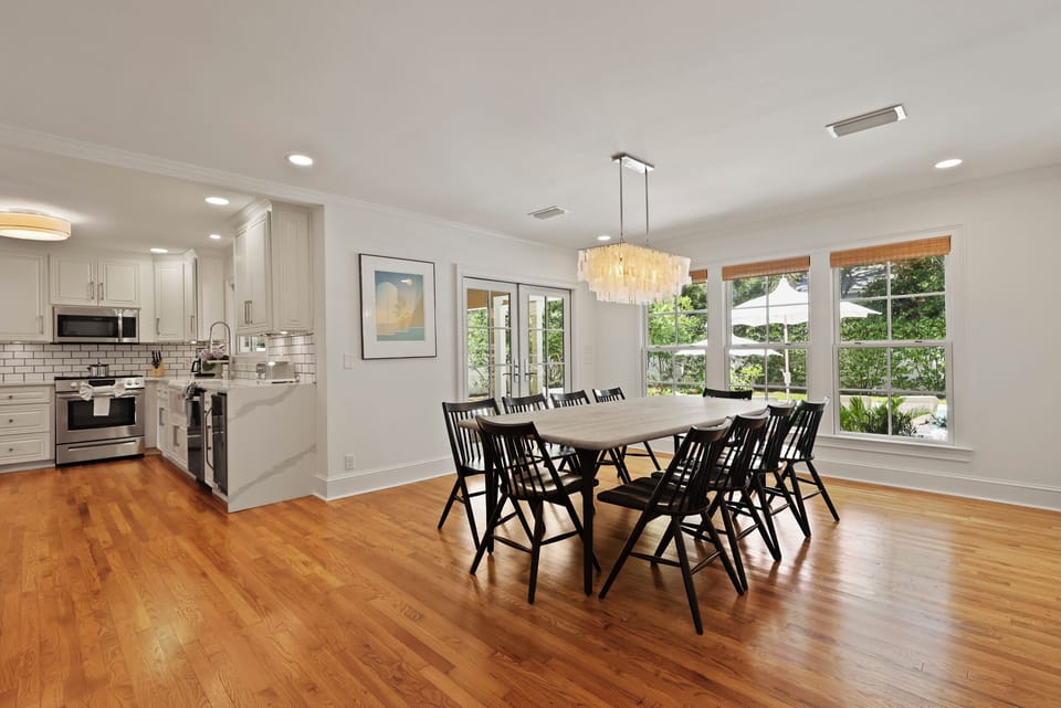 Dining Room table with seating for ten overlooking the pool view