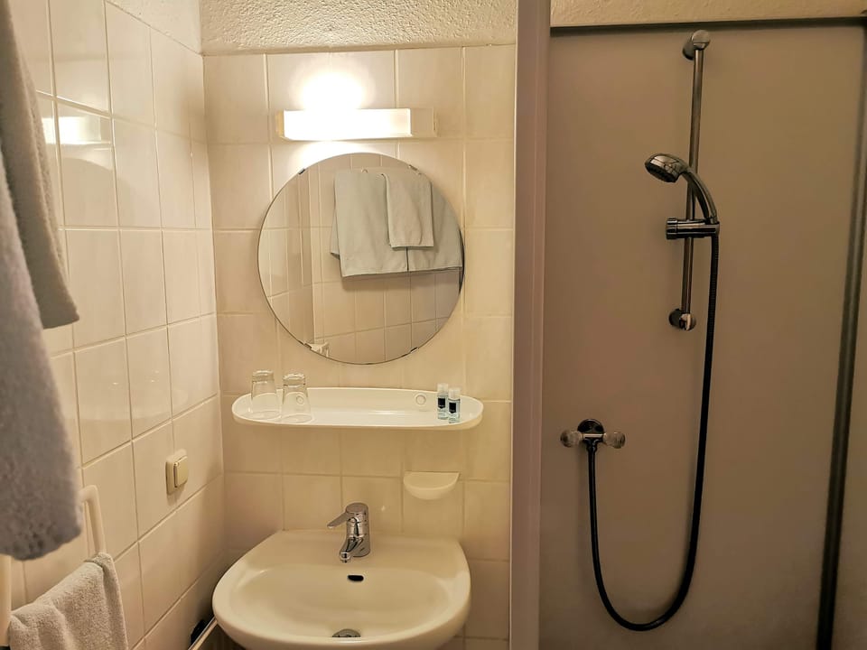 Classic Double Room | Bathroom | Shower, hair dryer, towels, soap
