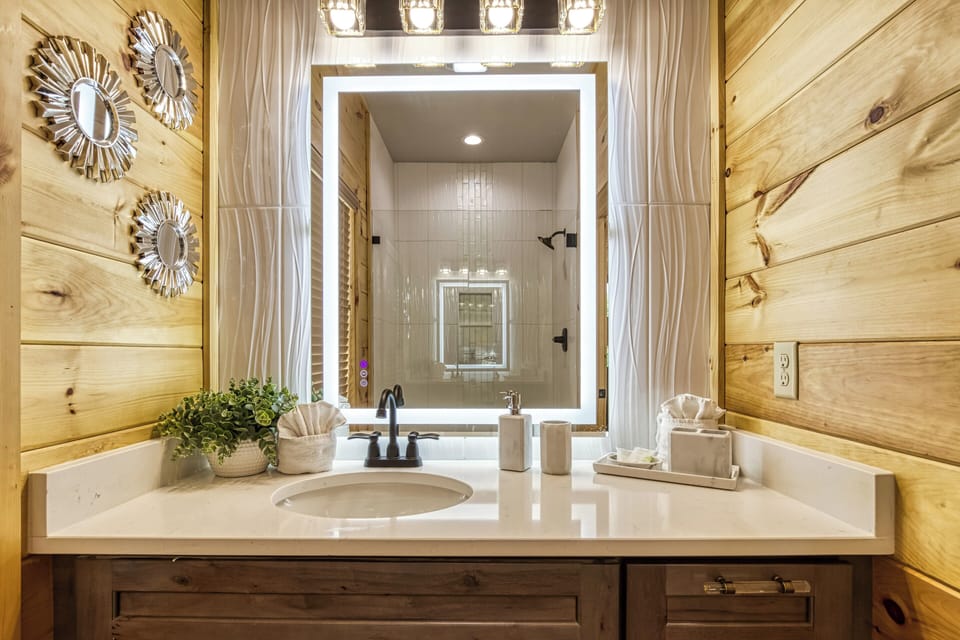 Smoky Mountain Luxury Cabin "Midnight Bowling" - Upper level loft bathroom with single vanity and heated mirror