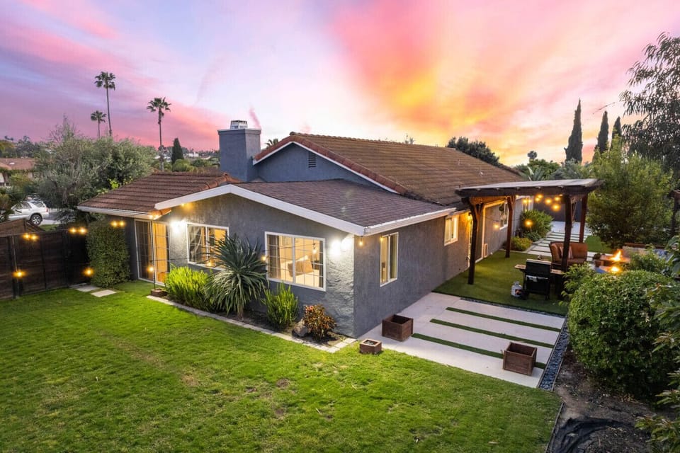 Relax by the outdoor dining area, unwind by the firepit, or enjoy a sunset BBQ under twinkling lights. Features include a private yard, covered patio, modern interiors, and plenty of space to soak up the California vibes!