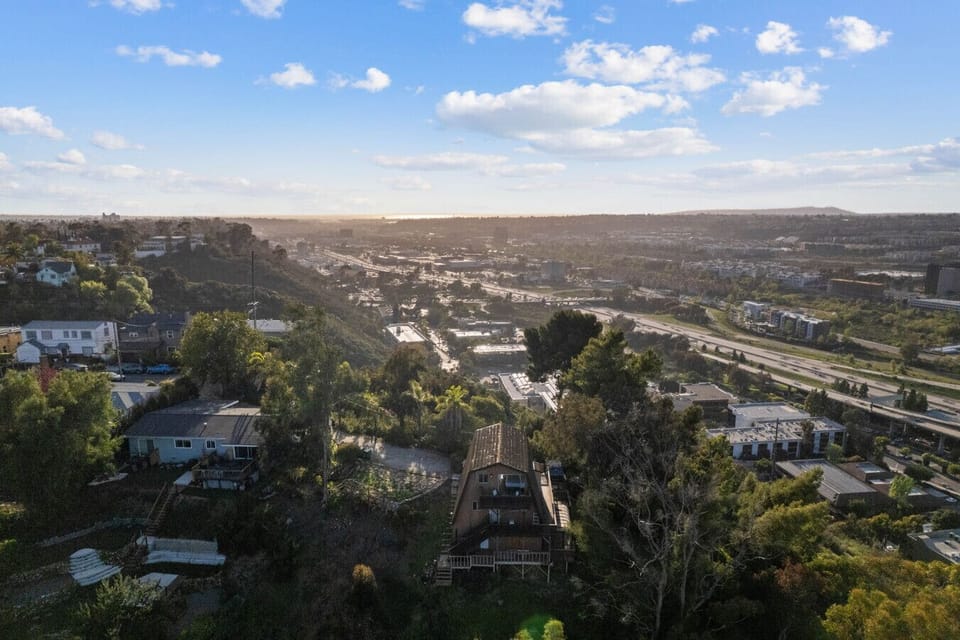Take in sweeping vistas stretching across Mission Valley and beyond from this extraordinary hillside perch.