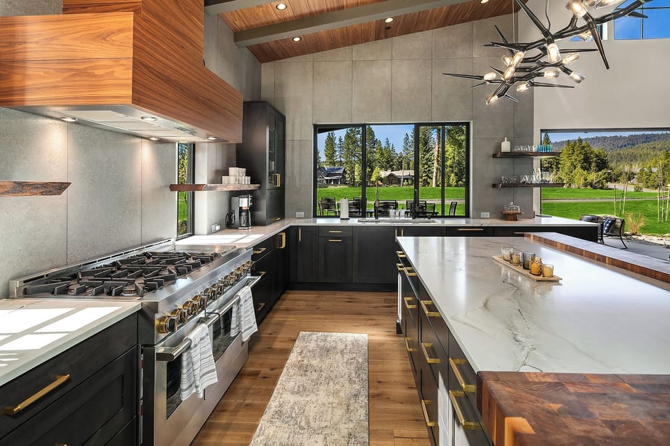 Living the Dream: - Massive Jenn-Air gas range with double ovens, 6 burners, and a skillet.