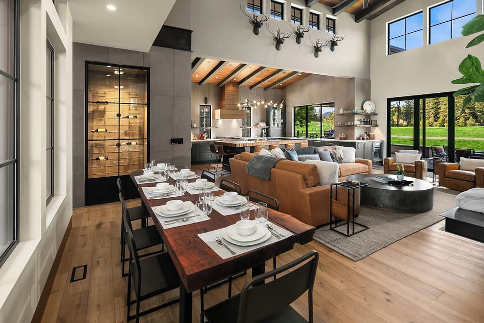 Living the Dream: - Beautifully appointed great room with soaring ceilings and a dining table for 8. (Extra card table and chairs provided)