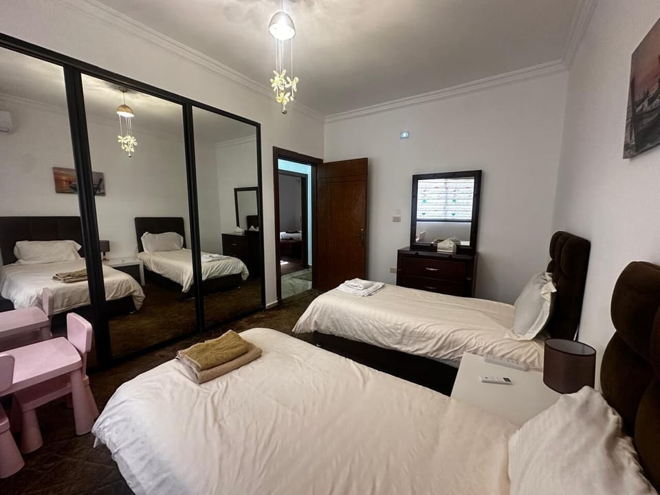 Bedroom 3 with storage closets, children's table and chairs