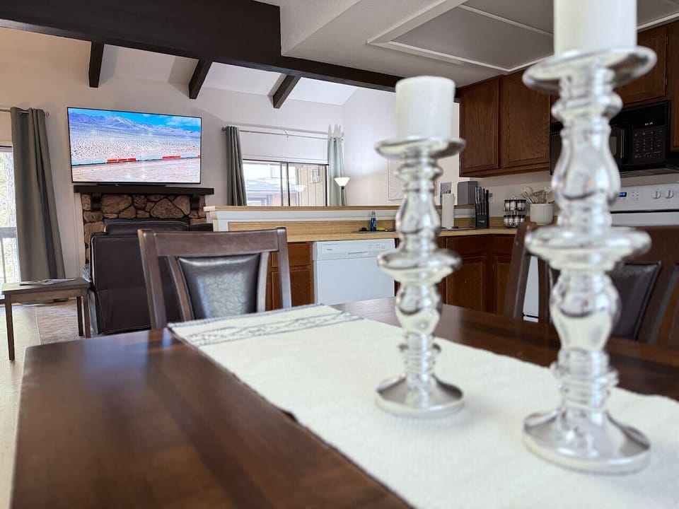 Dining area with seating for six and views of the well-equipped kitchen and spacious living room