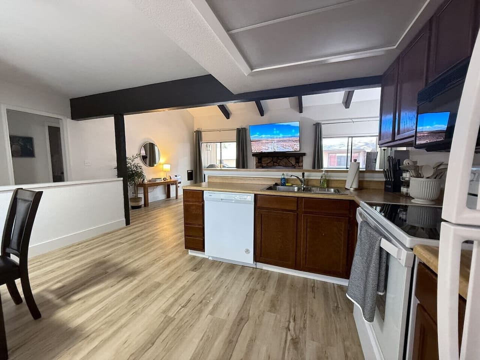 Well-equipped, fully stocked kitchen with dishwasher, range, microwave, and fridge