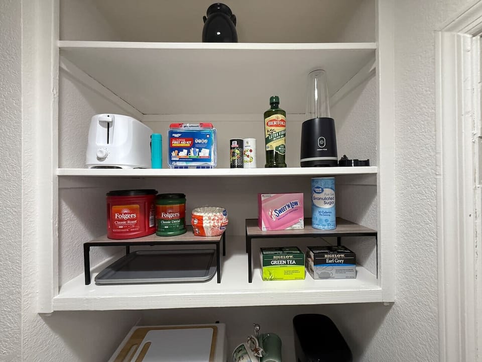 Kitchenette stocked with coffee (regular and decaf) for the drip coffeemaker, tea, and other cooking basics