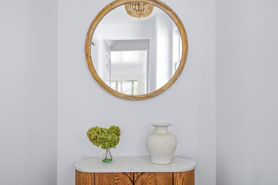 This welcoming entry sets the tone with warmth, style, and a splash of personality!