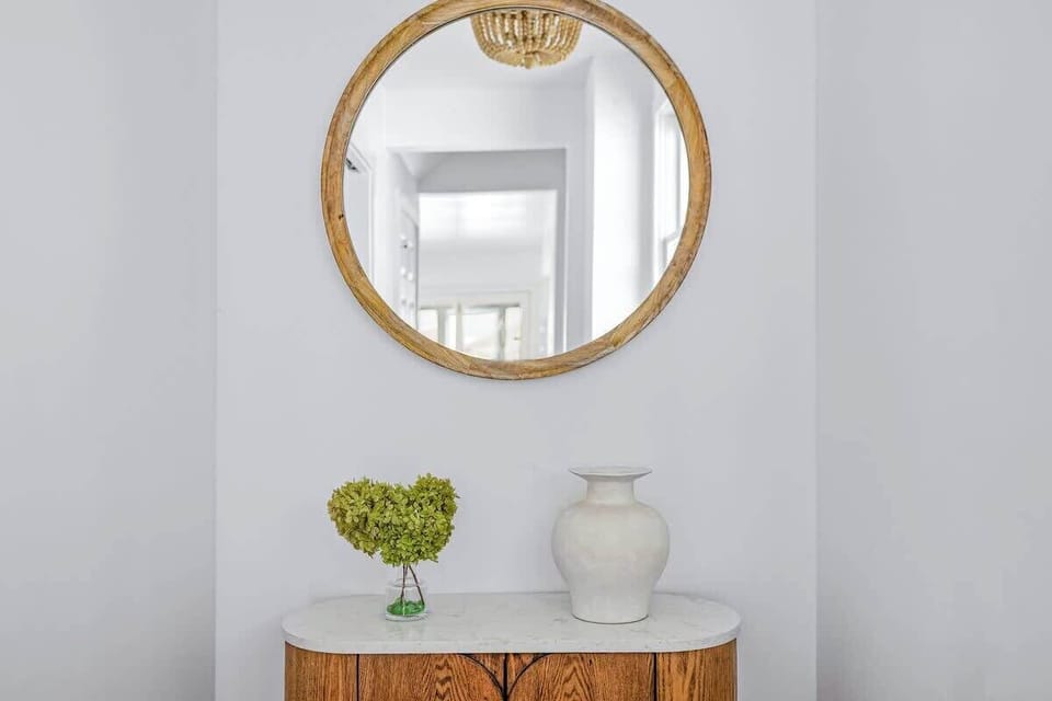 This welcoming entry sets the tone with warmth, style, and a splash of personality!