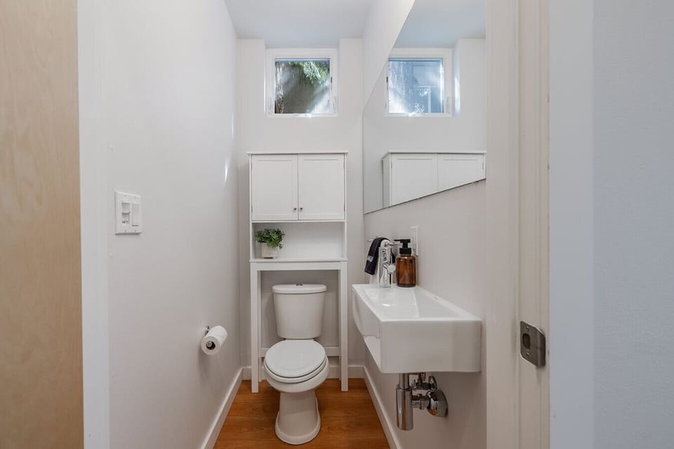 Convenience at its best with this sleek and stylish half bathroom!