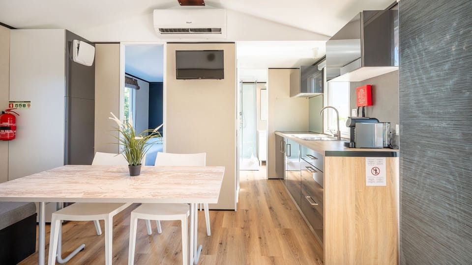 Cook with ease in this sleek kitchenette featuring modern appliances and thoughtful design. #StylishStay #HomeCooking #Portugal #PT