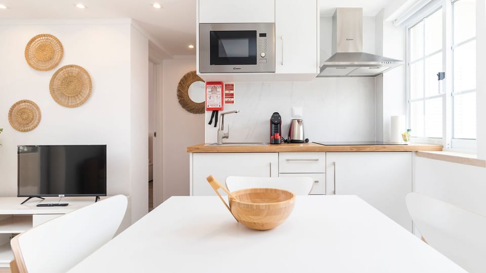 A bright, fully equipped kitchen with everything you need for home-cooked meals and morning coffee rituals. #KitchenGoals #CookAndUnwind
