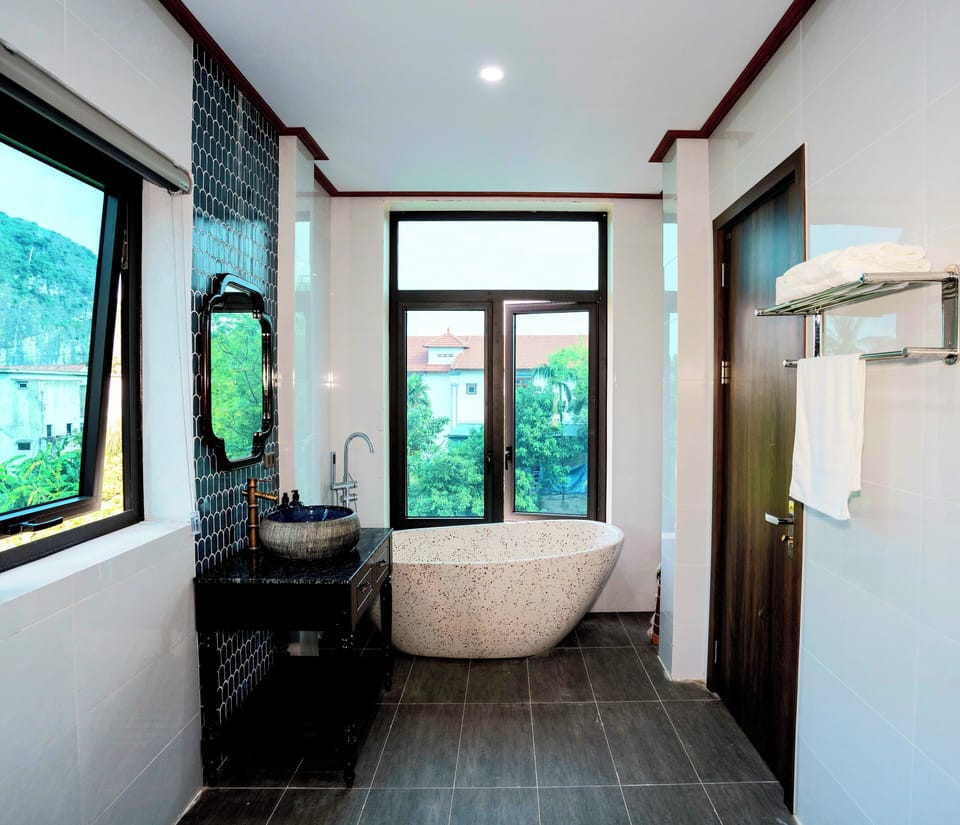 Premium Quadruple Room, Balcony, Mountain View | Bathroom | Rainfall showerhead, designer toiletries, hair dryer, bathrobes