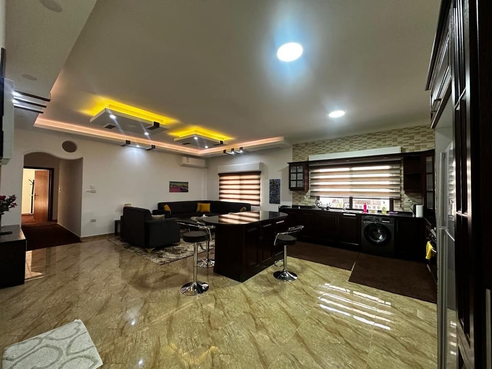kitchen, den, TV with satellite, and kitchen island