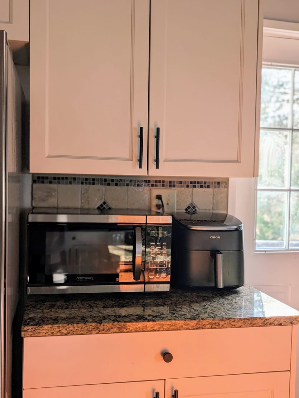 air fryer, microwave, gas stove/oven, double sink, dishwasher, and propane grill