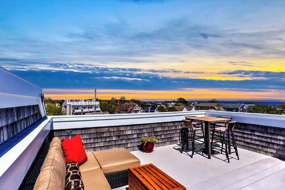Sink into the cozy outdoor sectional and toast to unforgettable sunsets.
