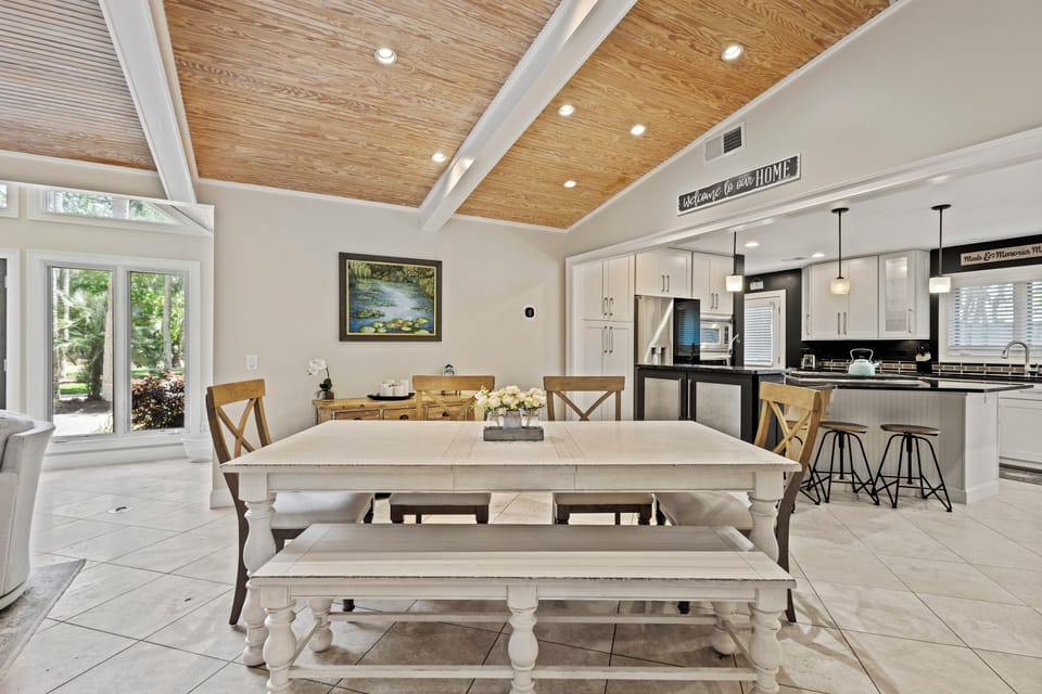 Dining table seats 6, plus additional bar seating at the island for 3
