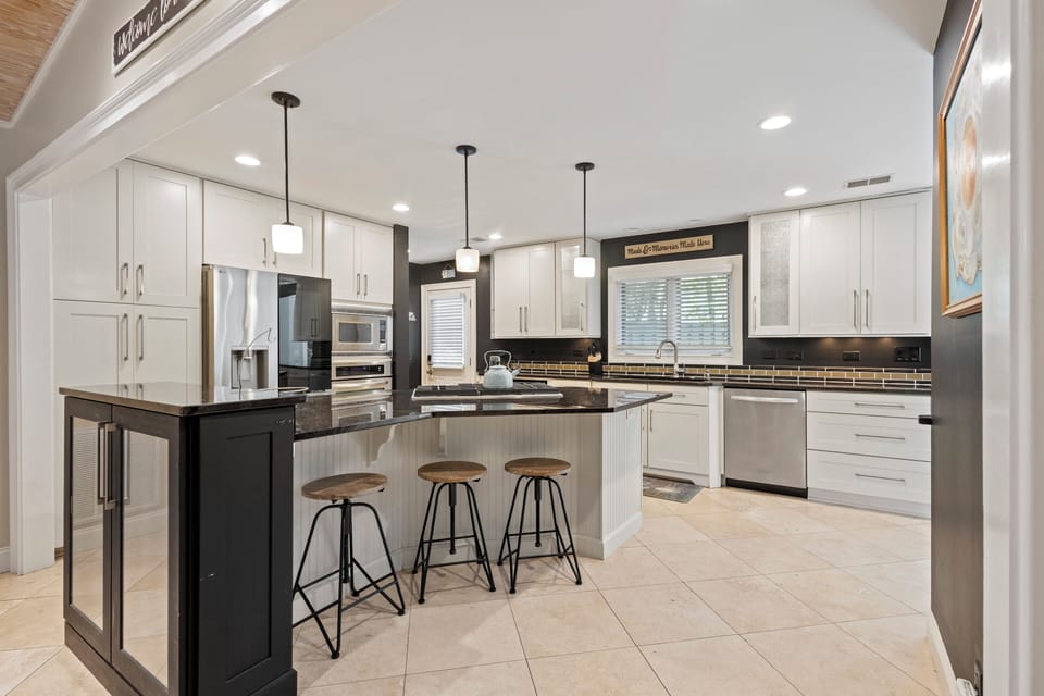 Calling all foodies! The chef's kitchen features high-end appliances, a gas range, and a stunning oversized island, so you can prepare meals with ease.
