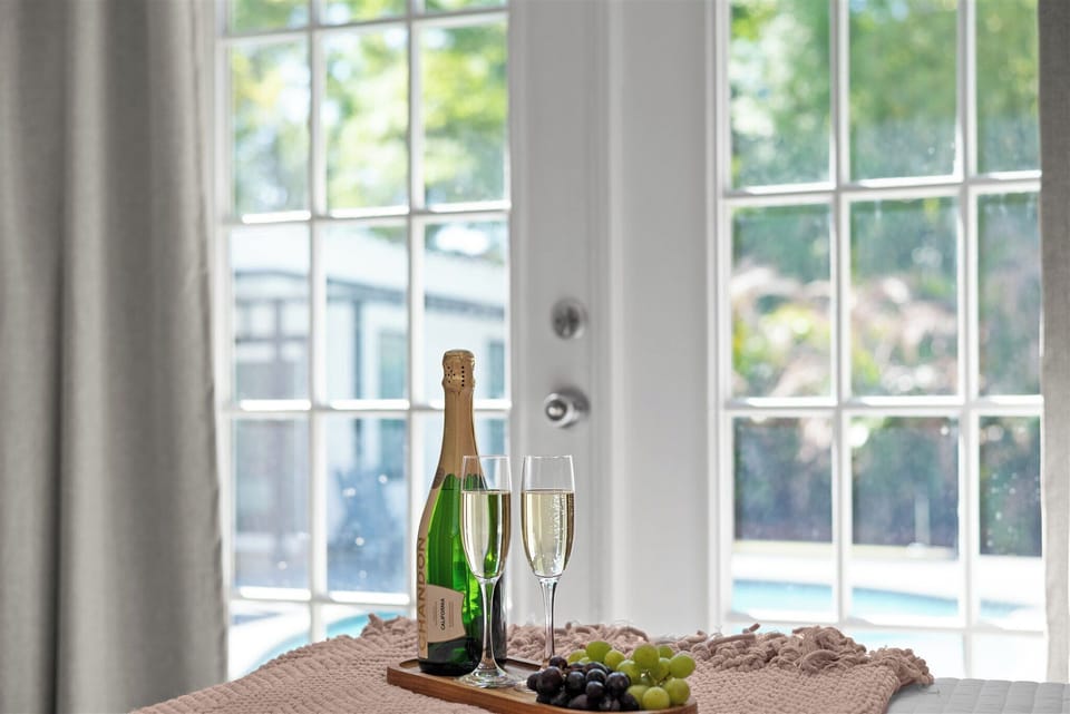Enjoy a beautiful view out to the pool from the primary suite.