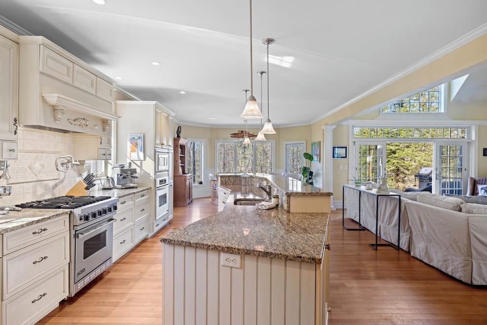 A kitchen made for a chef with a gas range and stocked to feed a crowd.