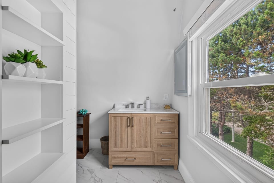 Renovated attached & hallway access bathroom.