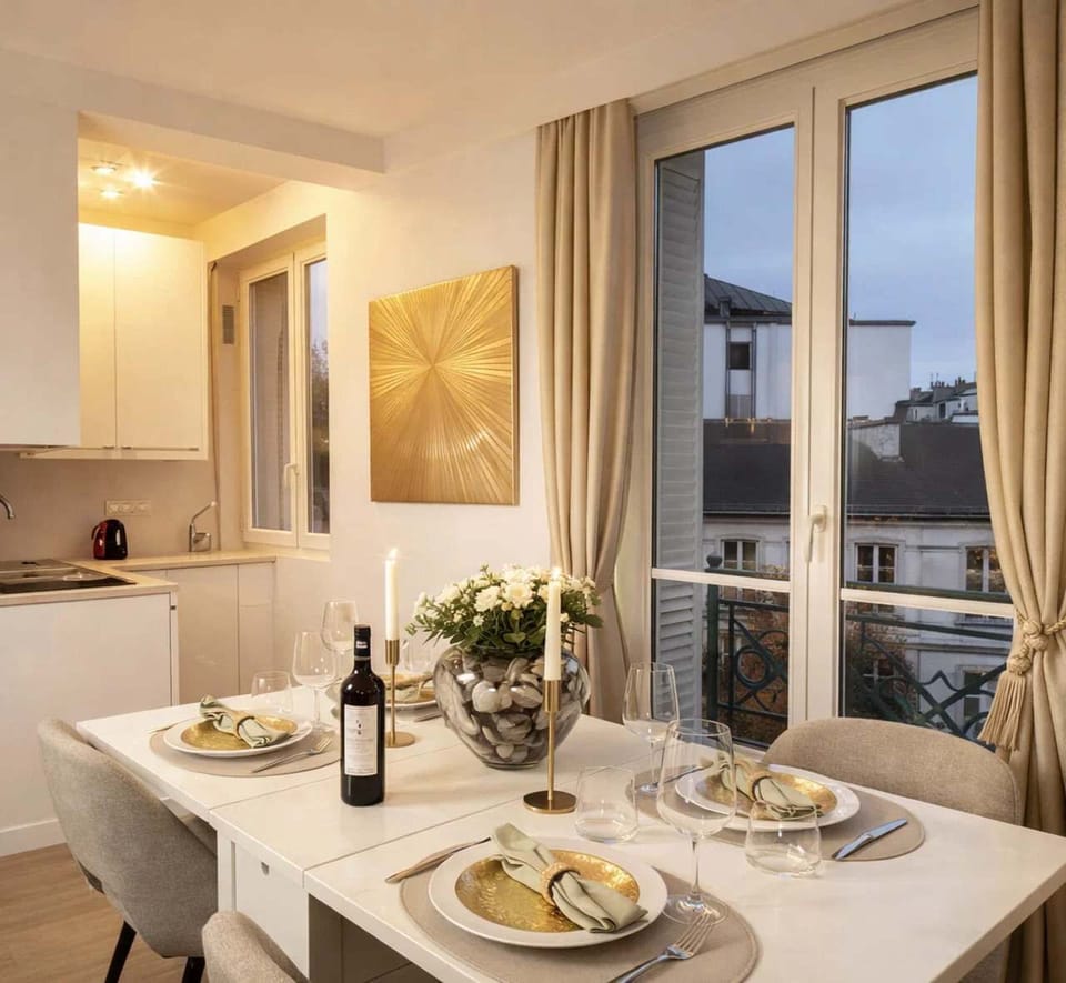 Dining table doubles as a work desk, seating four comfortably.