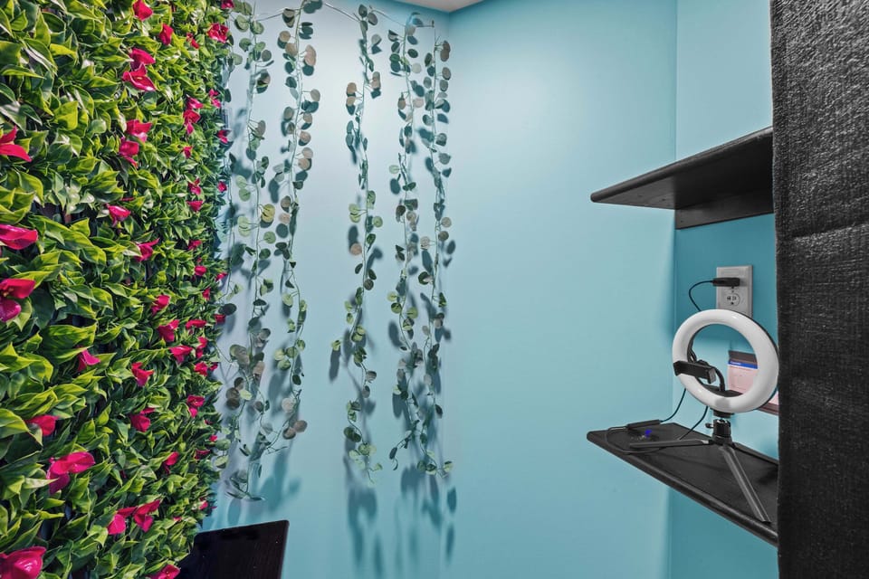 Get everyone into the photo booth corner. Turn on the ring light, strike a pose in front of the flower wall, and capture the memories you'll be talking about long after the trip ends.