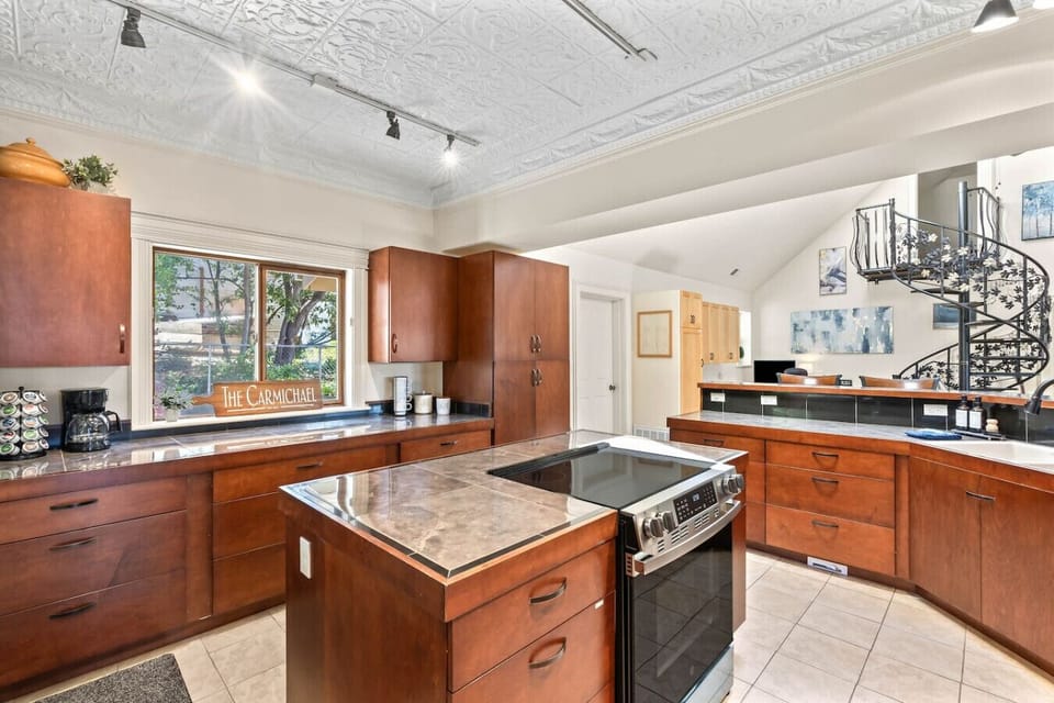 Large and fully stocked open concept kitchen to make your meals and never miss a moment with your group.