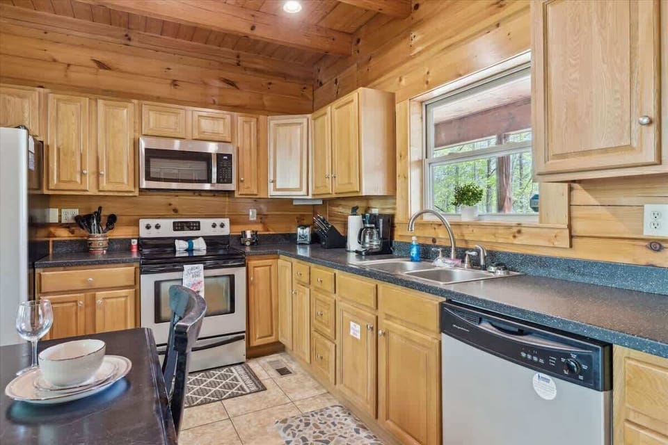 Kitchen: Cook up a feast in this well-equipped kitchen, featuring rustic charm and modern amenities!