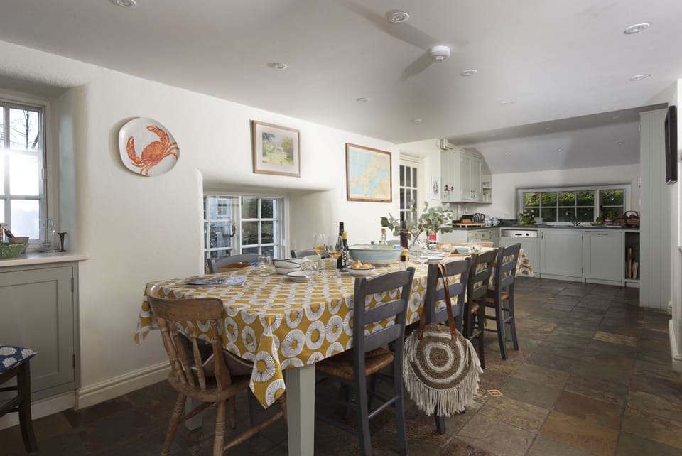 Sparnal Stitch, Rock. Ground floor:  A large wooden dining table provides ample space for up to ten guests