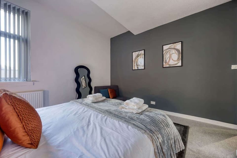 Layered linens and cosy cushions create a peaceful retreat