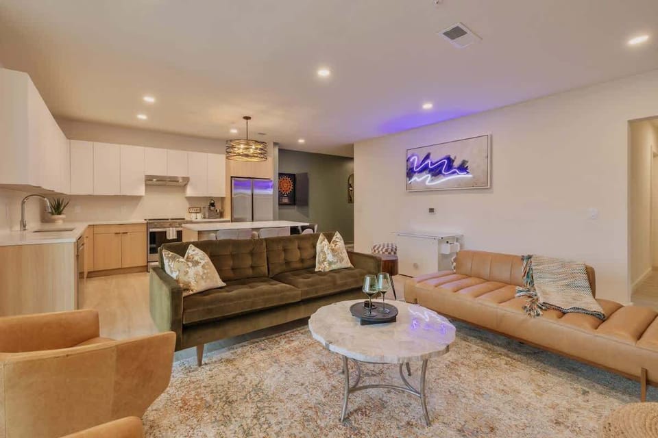 Living Room: features a cozy seating area with plush and earth-toned furniture.