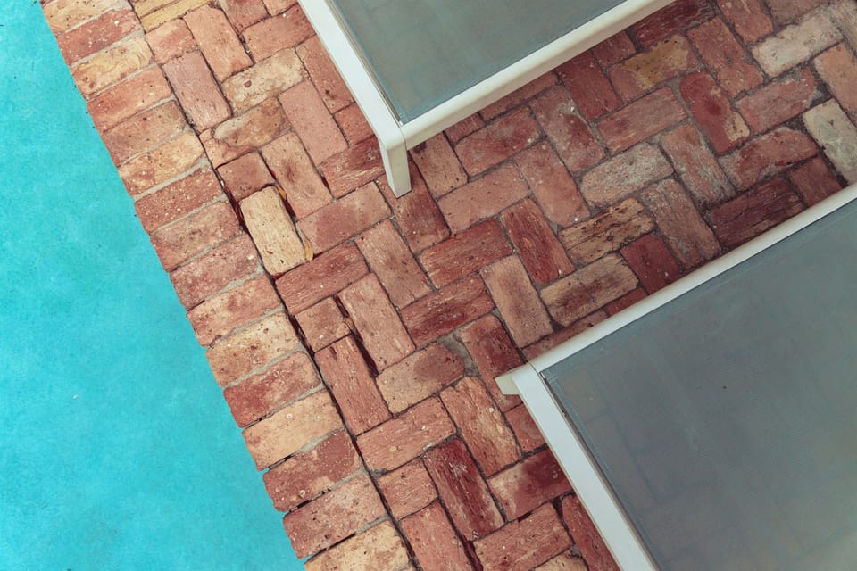 Relax all day, poolside, with your favorite drink in hand.