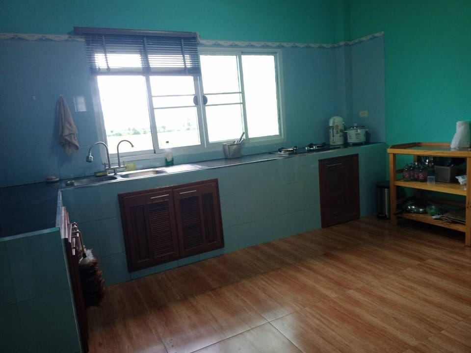 Indoor kitchen with RO water filter, gas stove, sink, and refrigerator