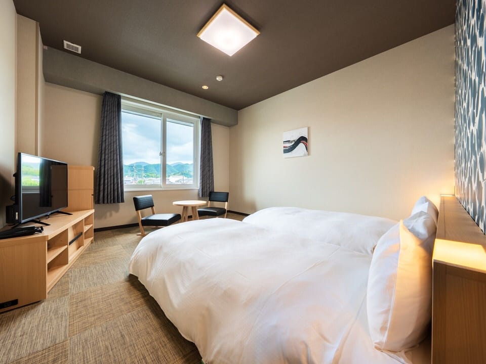 Twin Room, Non Smoking | Laptop workspace, iron/ironing board (on request), WiFi (free)