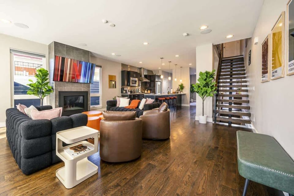 Primary living room with fireplace and kitchen