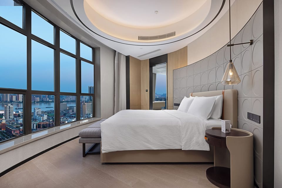 Signature Studio Suite | Premium bedding, down comforters, desk, laptop workspace