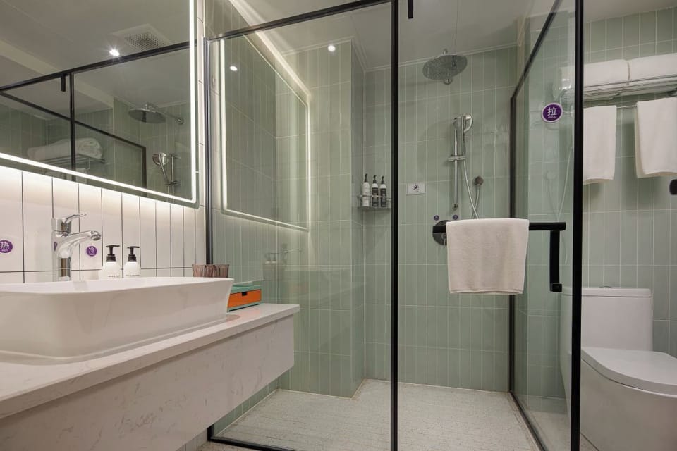 Shower, hair dryer, slippers, towels