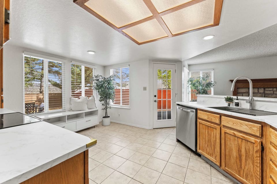 Bright and spacious, this fully equipped kitchen offers ample counter space, appliances, and beautiful natural light
