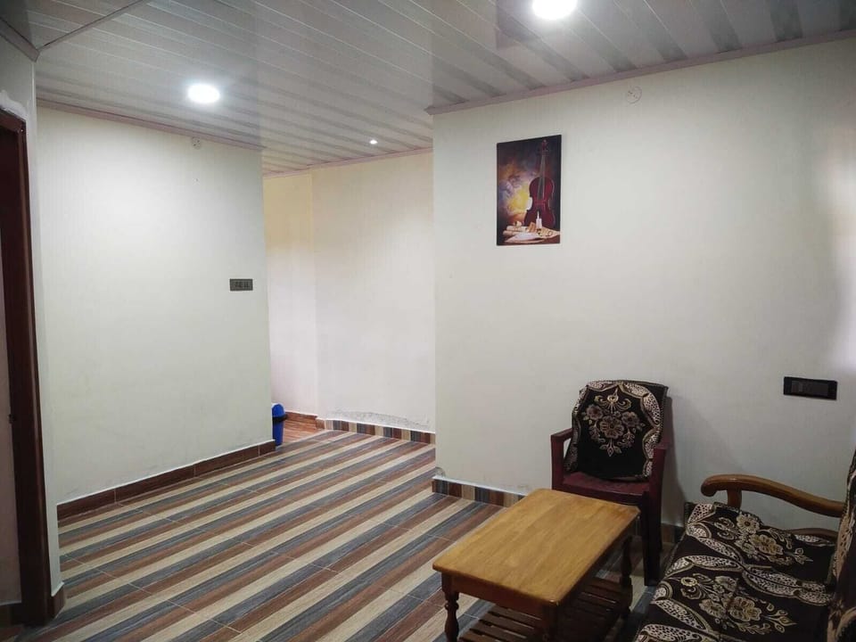 Deluxe Triple Room, Valley View | Living area | LED TV