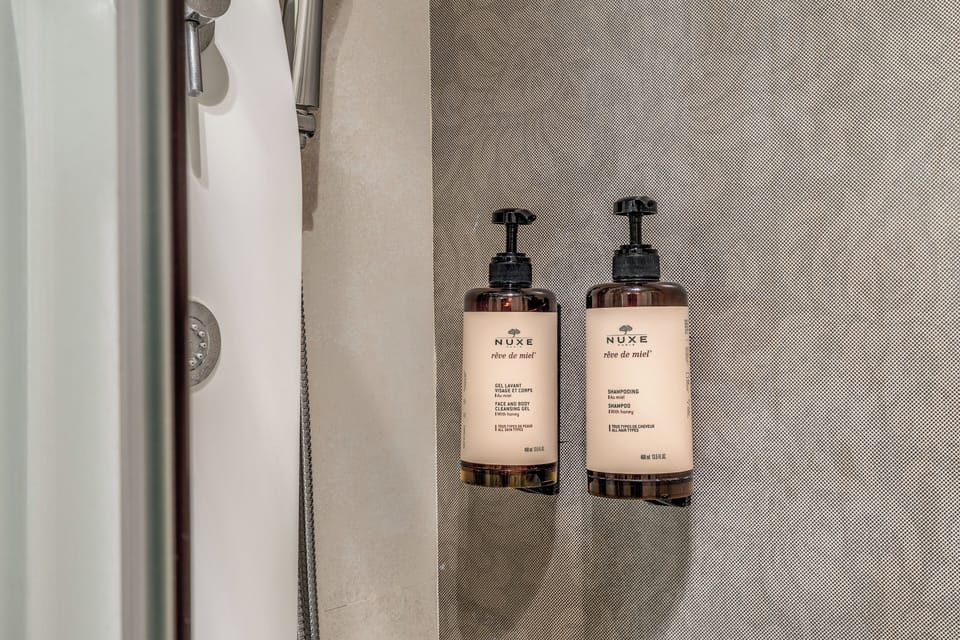 Shower, free toiletries, hair dryer, slippers
