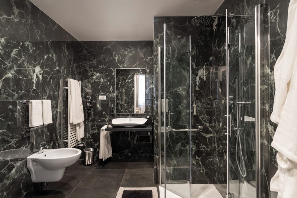 Deluxe Triple Room, Non Smoking | Bathroom | Shower, hair dryer, slippers, towels