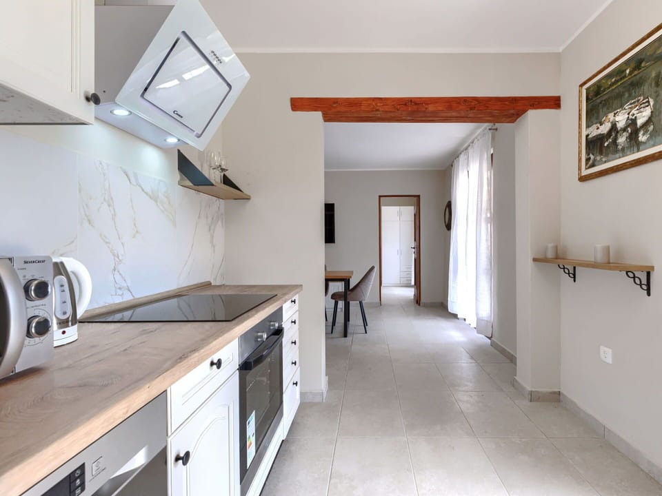 Furniture, Flooring, Interior Design, Countertop, Wood, Ceiling, Floor, Cabinetry, Room, Kitchen