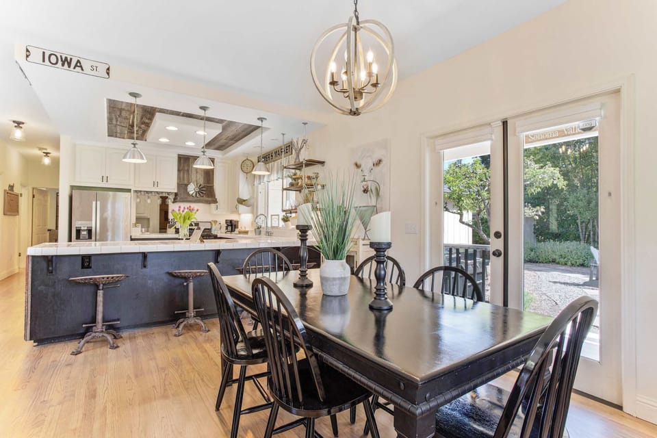 Dinner is served. The dining area flows right from the kitchen, making it easy to transition from a busy prep session to a long, lingering feast with the whole group.